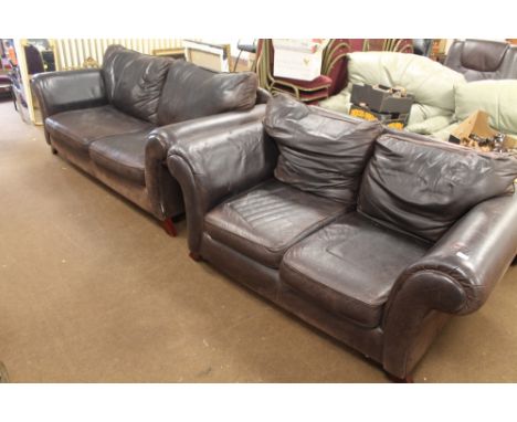 A TWO PIECE SUITE CONSISTING OF A TWO SEATER SOFA AND A THREE SEATER SOFA