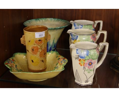 A CHARLOTTE RHEAD CROWN DUCAL VASE, TOGETHER WITH A SELECTION OF CROWN DEVON CERAMICS & A SET OF GRADUATED JUGS