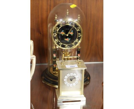 A GLASS DOMED KUNDO ANNIVERSARY TOGETHER WITH A MODERN CARRIAGE CLOCK
