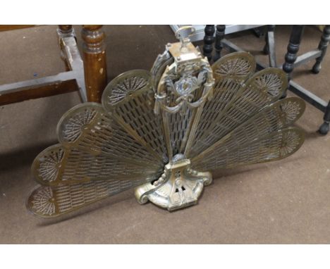 A DECORATIVE FOLDING ART NOUVEAU STYLE BRASS FIRE SCREEN