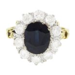 18ct gold oval cut sapphire and round brilliant cut diamond cluster ring