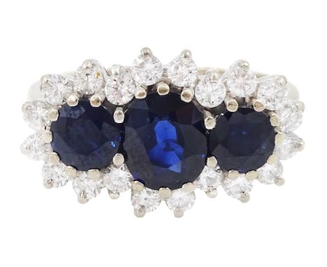 18ct white gold three stone oval and round cut sapphire and round brilliant cut diamond cluster ring, London 1986, total sapp