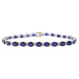 18ct white gold oval cut sapphire and round brilliant cut diamond bracelet