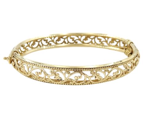 9ct gold fancy openwork scroll design hinged bangle, stamped 375Condition Report:Approx 9.6gm, inner circumference = 18.5cm, 