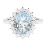 18ct white gold oval cut aquamarine and round brilliant cut diamond cluster ring