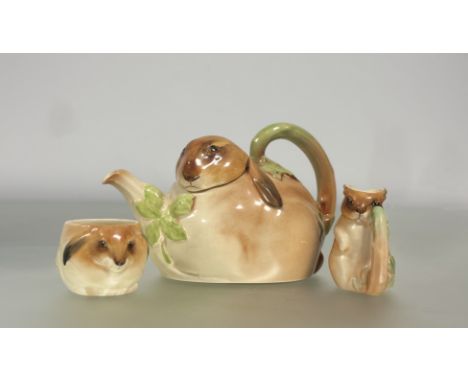 A&nbsp; very rare 1930's Royal Doulton "Bunnykins" three piece tea service, designed by Charles Noke, comprising a teapot mod