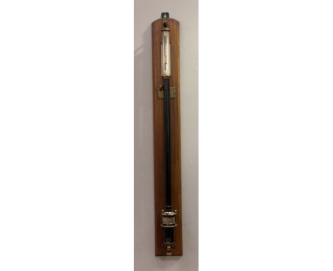 A 19th C. marine barometer and thermometer, the black lacquered tube with silvered registers mounted on a mahogany panel with