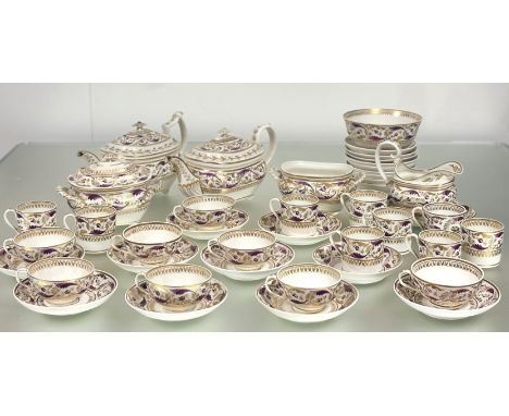 An early 19th century Derby partial tea service, decorated in a pattern of leaves and flowerheads in puce and gilt, painted a