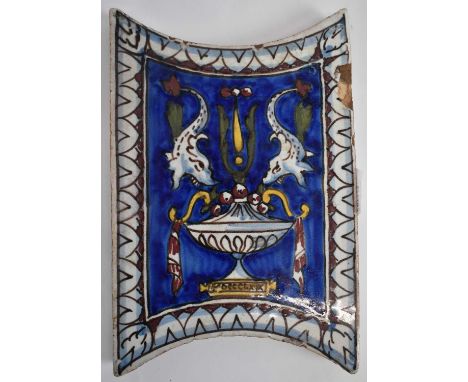 A 19th century painted tile in the Eastern taste, dated in Roman Numerals for 1869, 19 x 12.5cm.