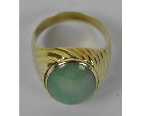 A 14ct yellow gold jade set ring, size U, approx. 7.1g. 