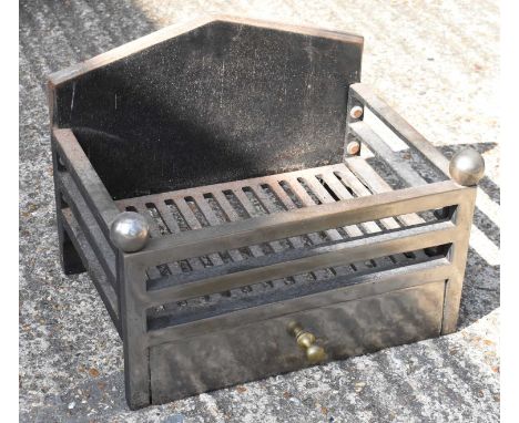 A cast iron and brass fire grate, width 40cm.