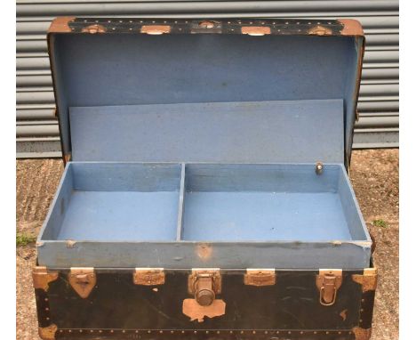 A metal bound travelling trunk.