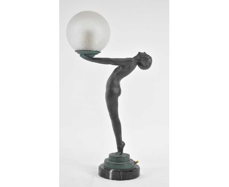 † MAX LE VERRIER (1891-1973); a French Art Deco patinated spelter figural lamp modelled as a nude female leaning back her arm