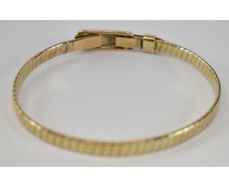 A 9ct yellow gold bangle, approx. 13.1g. 