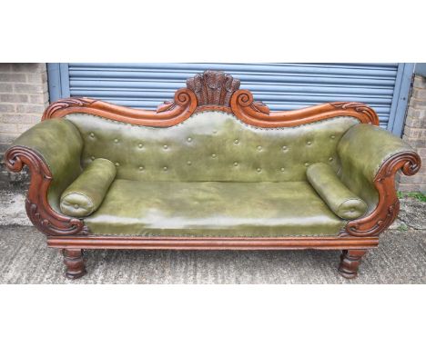 A good William IV/early Victorian mahogany framed green leather upholstered sofa, width 212cm.