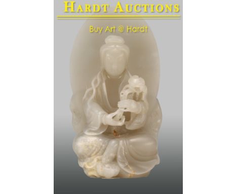 JadeChinaDimensions Height 11 cm by 6 cmWeight: 190 gramsWhite Jade carving of the Bodhisattva Guanyin, here seated, dressed 