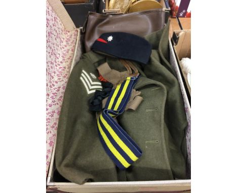 A suitcase containing an Army overcoat, hat etc.