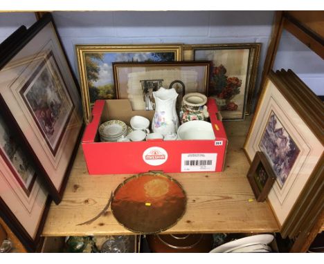 A shelf of assorted pictures, prints and china etc.