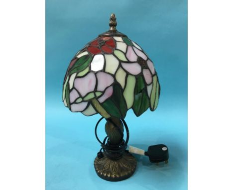 A small Tiffany style table lamp