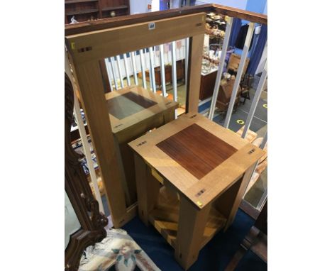 A heavy modern light oak table and matching mirror