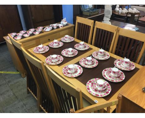 A light oak Barker and Stonehouse two tone dining room suite, comprising sideboard, extending table and six chairs