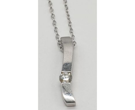 18k gold and diamond set pendant on a 46cm long 9ct gold chain , weight 1.3g and pendant 17mm long approx 