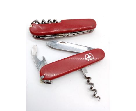 A pair of Swiss army knives.