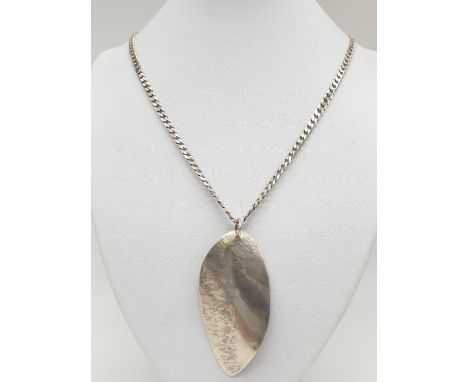A silver leaf pendant on a 50cm silver chain. 30.2g in weight. 