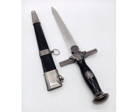 A quality production Nazi dagger. Metal blade, with a metal and leather scabbard. Excellent condition. 45cm long. 