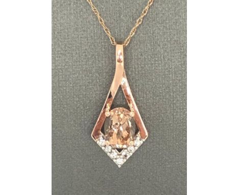 Pendant in 10K rose gold with CZ and morganite with chain in rose gold. Aprox 18" and weighs 1.9g. 