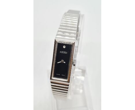 Vintage ladies Roamer wristwatch. Square black face with white hands having silver chrome strap. Manual winding, perfect cond