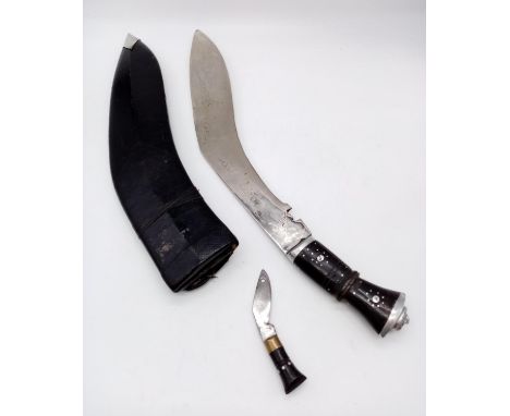 A large Gurkha vintage kukri knife with patterned inscription on blade, with scabbard. 50cm long. 