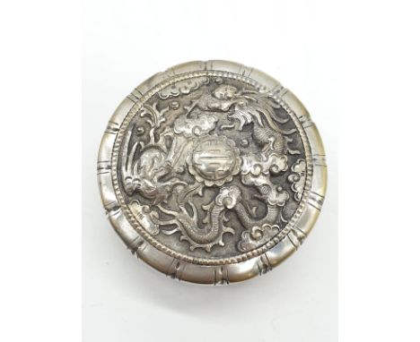 Vintage large white metal snuff box with raised dragon top. Lid fitting snug and tight Size 6.75 cm diameter. 