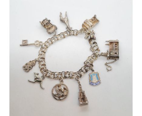 Silver charm bracelet having 10 assorted silver charms attached to a quality heavy silver linked bracelet. Complete with silv