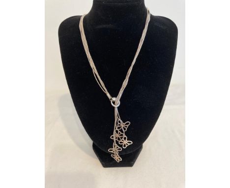Silver fine strand necklace, each strand having a butterfly pendant. Pull through style to front with lobster clasp at back. 