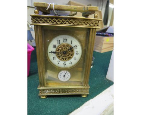 GILT BRASS CASED CARRIAGE ALARM CLOCK, ARABIC CHAPTER WITH PIERCED WORK TO DIAL, UNSIGNED MOVEMENT, WITH KEY