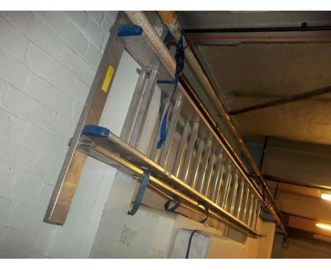 A TWELVE RUNG ALUMINIUM EXTENDING LADDER