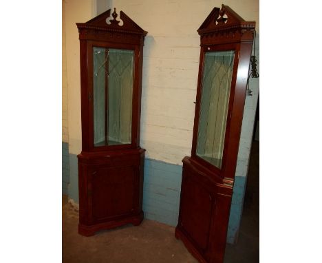 TWO MATCHING YEW LOCKING CORNER DISPLAY UNITS WITH LIGHTS AND SERPENTINE FRONT SHELF