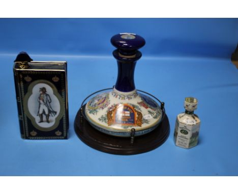 TWO NAVAL ITEMS TO INCLUDE PUSSERS RUM BOTTLE AND STOPPER COMMEMORATING HMS VICTORY TRAFALGAR 1805 ON WOODEN PLINTH, HORATIO 