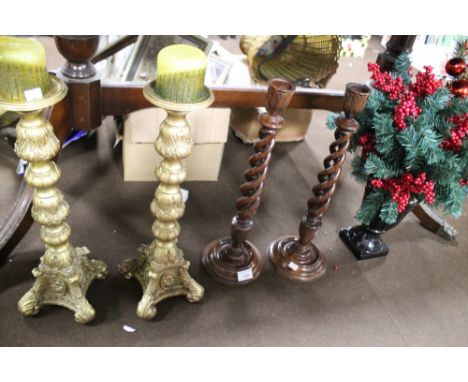 TWO PAIRS OF CANDLESTICKS, ONE TALL WOODEN BARLEY TWIST 48 CM HIGH AND OTHER TALL GILT 46 CM AND A CERAMIC VASE WITH CHRISTMA