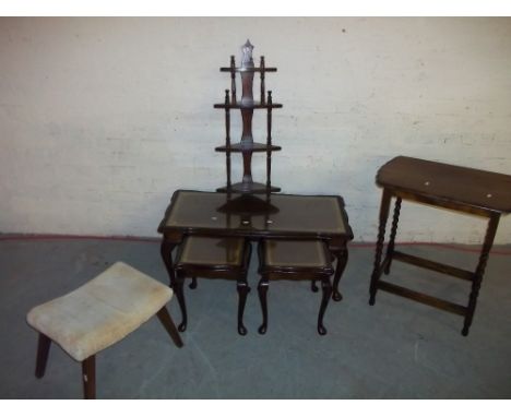 A LEATHER INLAID NEST OF TABLES COMPRISING COFFEE TABLES WITH TWO MATCHING SIDE TABLES, A SMALL HANGING WOTNOT SHELF, A VINTA