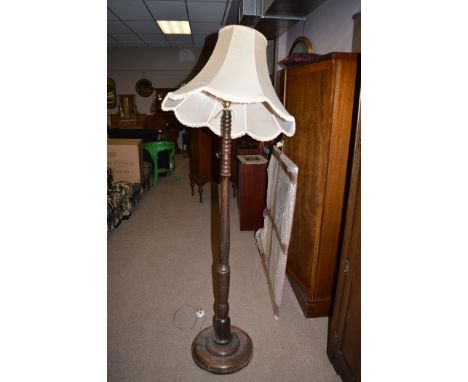 A turned stained beach standard lamp.