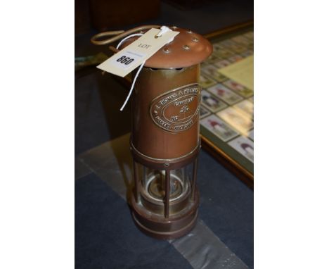 A miner's lamp by E. Thomas & Williams Ltd., marked No.51227, Cambrian.