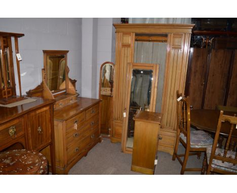 A light birch bedroom suite comprising dressing table, single mirrored wardrobe and bedside cabinet.