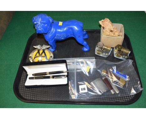 A cast metal model of a bulldog inscribed 'Record Bulldog'; an AA car badge; a fountain pen and ballpoint pen in fitted case;