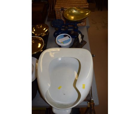 A ceramic bed pan; a guillotine; a set of scales and weights; and other items.