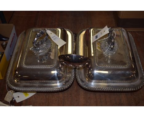 A pair of silver plated rectangular entree dishes and covers; together with a silver plated ladle.