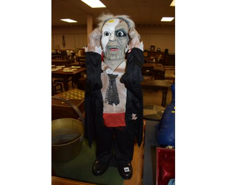 A battery powered Zombie figurine, with sound button.