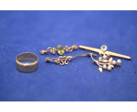 A 9ct. yellow gold ring, ring size K; and four yellow metal brooches, some stamped '9ct.', some set with seed pearls, 12.5grm