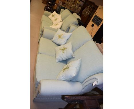 A pair of two seater light green finish settees and a matching arm chair.